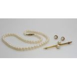 A 42cm long string of cultured pearls with a 9ct gold clasp, together with a 9ct gold bar brooch and
