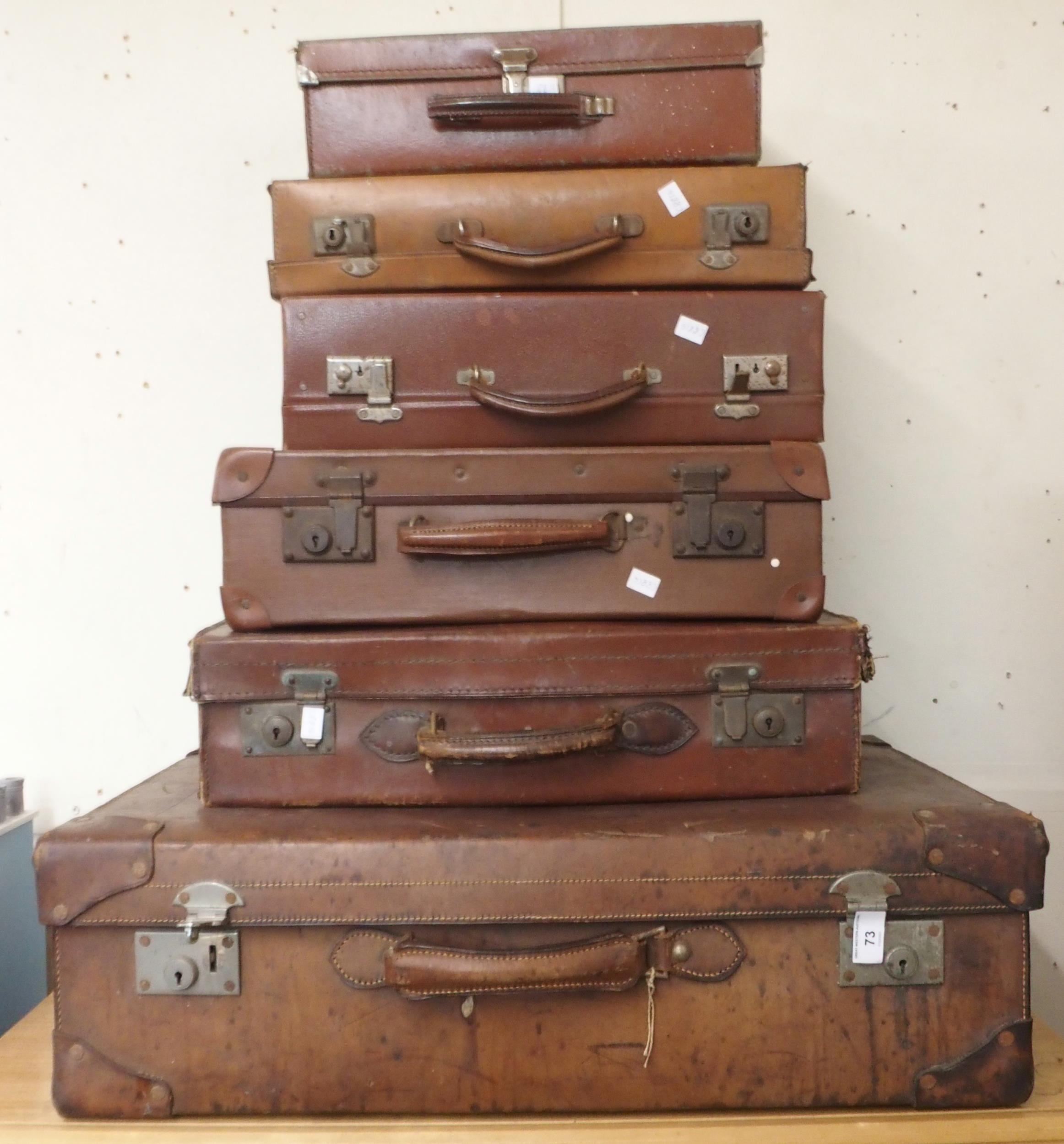 A lot of six assorted late 19th/early 20th century leather travel cases (6) Condition Report: