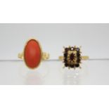 An 18ct gold garnet cluster ring, size M1/2, together with a 18ct gold coral set ring size P1/2,