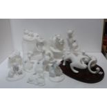 A collection of white glazed Royal Doulton Images sculptures of cats and dogs including Soul