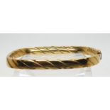 A 9ct gold twist pattern bangle 10.1gms Condition Report:Available upon request