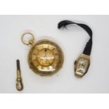 An 18ct gold open face fob watch with decorative gold dial, weight including mechanism 50.1gms,