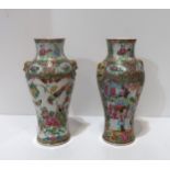 A pair of Chinese export famille rose canton vases, each with figural decoration Condition Report: