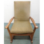 A mid 20th century teak framed Toothill rocking chair with moss green upholstery, 90cm high x 65cm