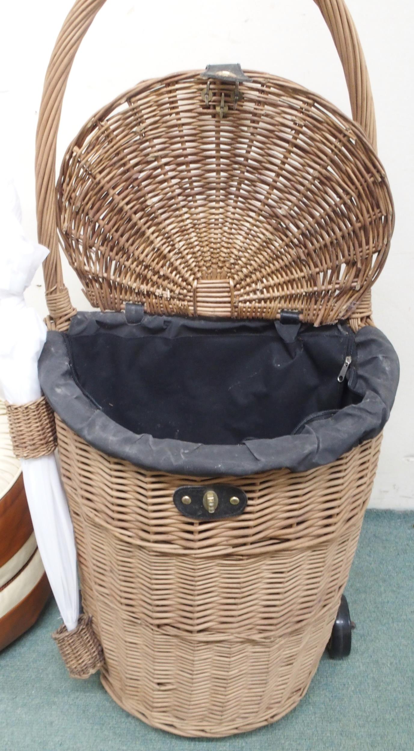 A 20th century basket woven shopping trolley, leather upholstered poof and a strung footstool (3) - Image 2 of 2