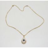 A 9ct gold sapphire and diamond pendant, length of pendant 3cm, length of box chain 50cm, weight 4.