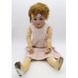 A large doll with articulated limbs and blinking eyes, the head stamped "SH 1079 DEP, Germany" and