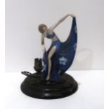 A German Art Deco pottery figure of a dancing girl, mounted on wooden lamp base, missing mirror