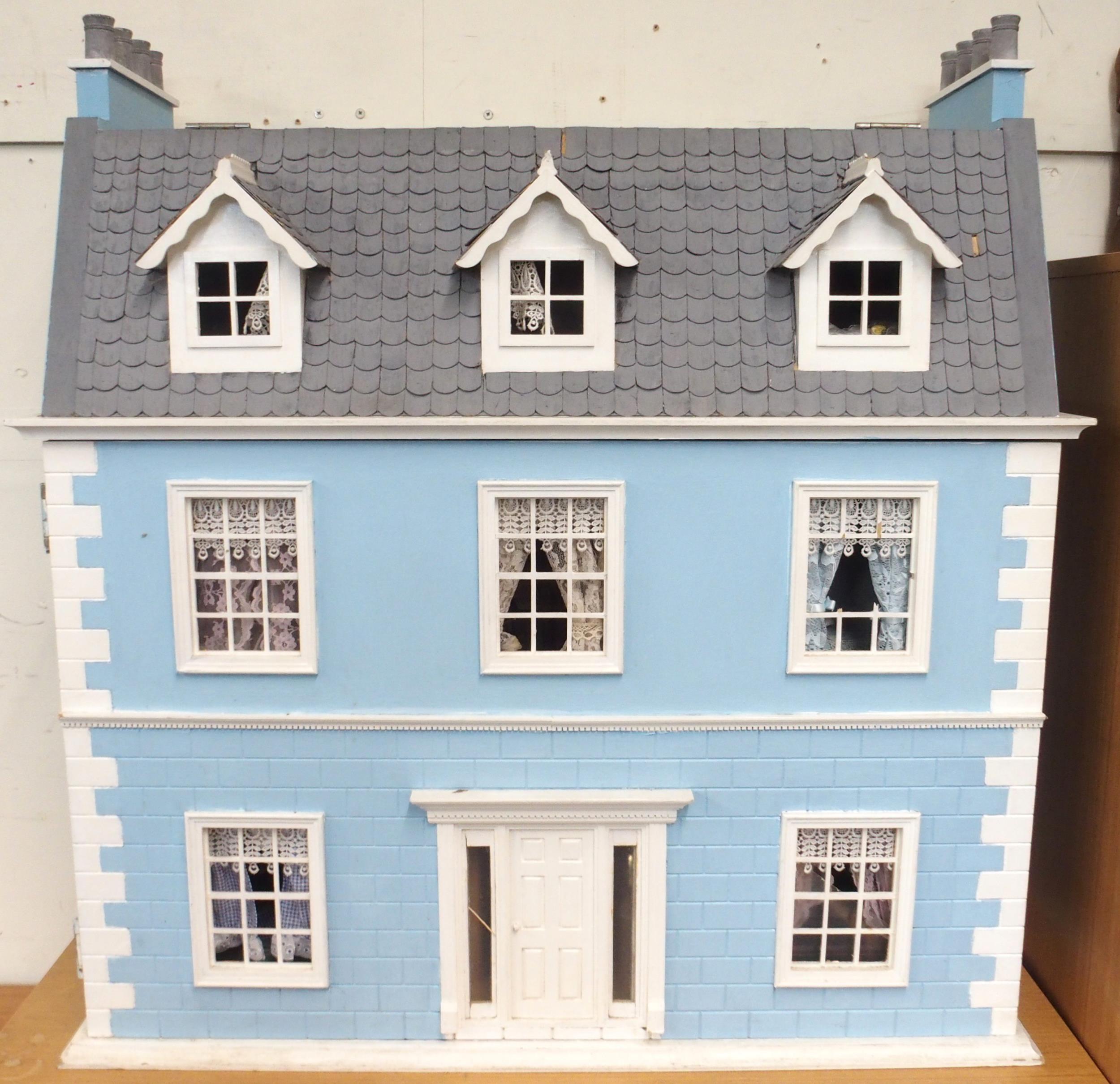 A 20th century three storey dolls house with assorted furniture and figures etc, 84cm high x 80cm - Image 2 of 13
