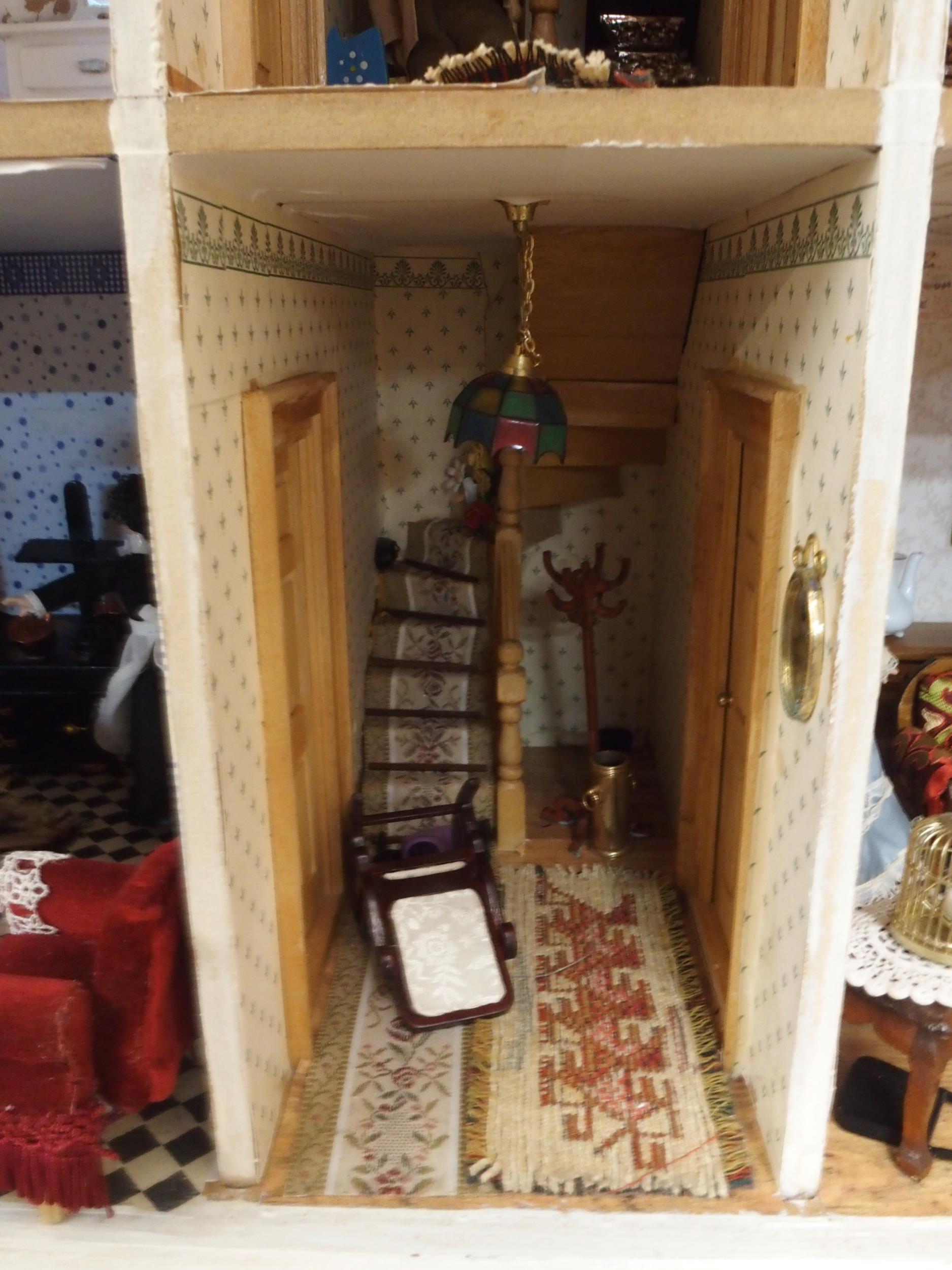 A 20th century three storey dolls house with assorted furniture and figures etc, 84cm high x 80cm - Image 11 of 13