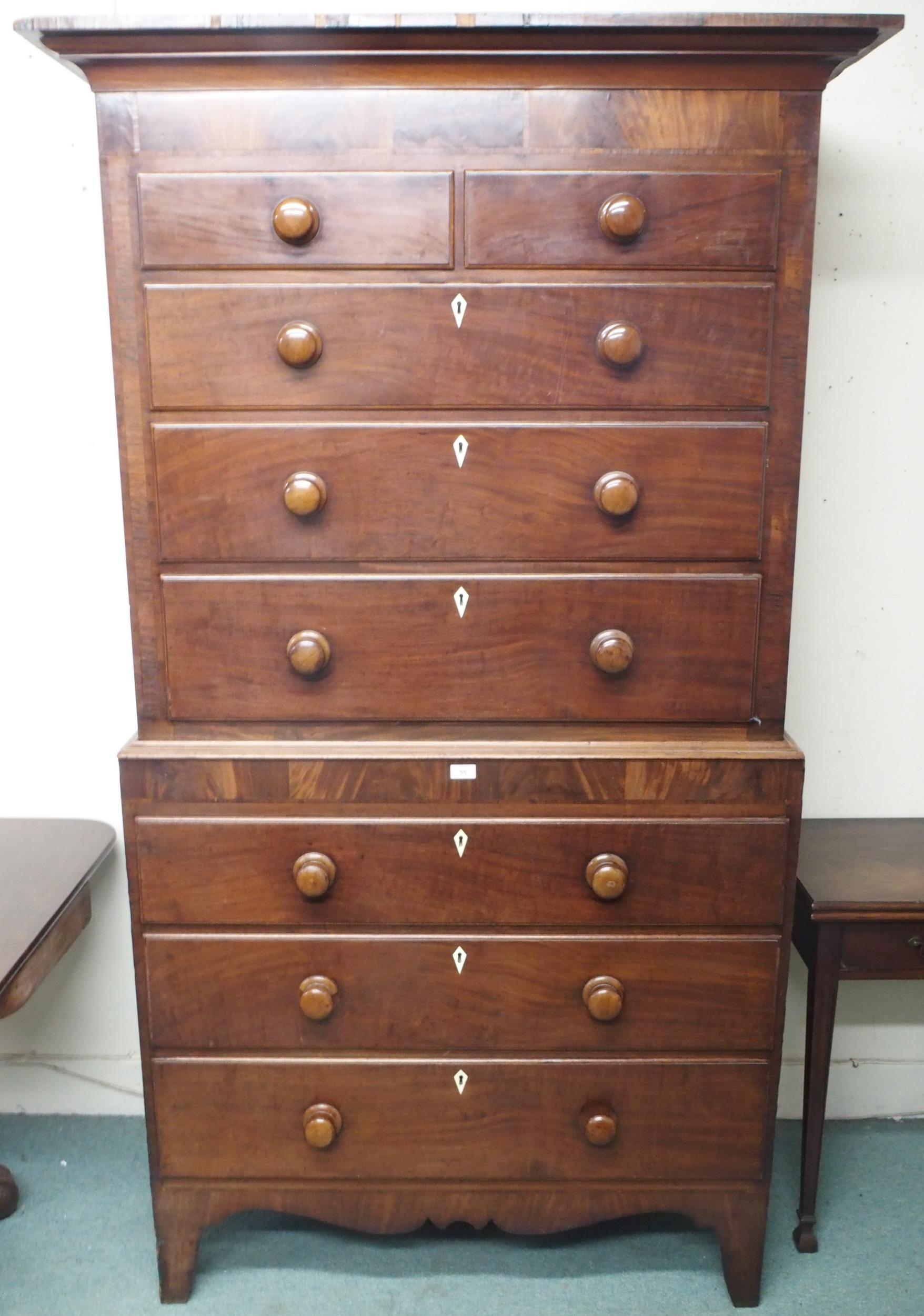 A Victorian mahogany chest on chest with moulded cornice over two short over three long drawers on