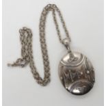 A silver Edwardian locket hallmarked Birmingham 1920 Ward Brothers length with bail 6.8cm x 4cm,