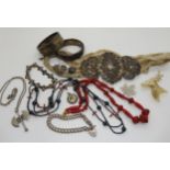 Two silver bangles, a Max Neiger red glass bead necklace, a Chinese silver buckle, and other items