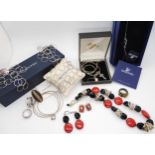 A silver statement bracelet and earring set by Italian designer Pianegonda, a Swarovski Designer