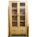 A contemporary oak John Lewis glazed bookcase with pair of glazed doors over two long drawers, 190cm