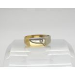 A 14k gold two tone diamond set ring, diamond approx 0.05cts, finger size S1/2, weight 3.9gms