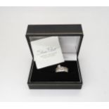 A Sheila fleet designed platinum and diamond set engagement ring and matching wedding band.