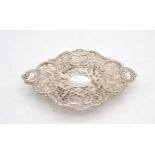 A Chinese export silver footed dish, by Wang Hing, the body with pierced floral openwork, the centre
