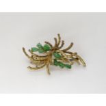 A 14k gold retro style Chinese green hardstone brooch length 5.7gms, weight 12.2gms Condition