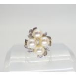 A 9ct gold pearl and diamond accent ring, size M1/2, weight 4.6gms Condition Report:Available upon