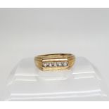 A gents 9ct gold five diamond ring, set with estimated approx 0.17cts of brilliant cut diamonds,