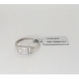 A 9ct gold princess cut square cluster ring with further brilliant cuts set to the shoulders, to