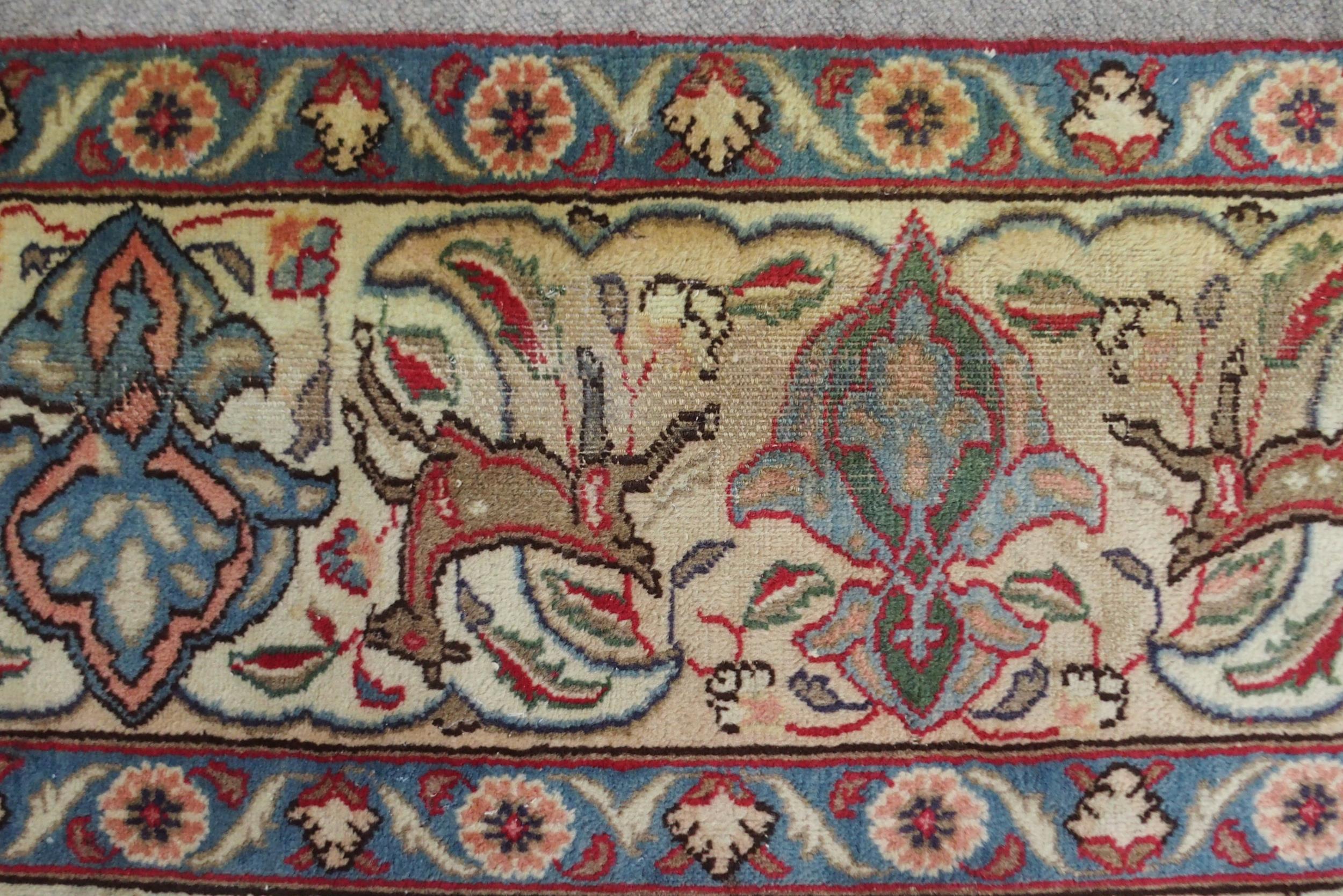 A MULTICOLOURED GROUND KASHMAR RUG with red and blue central medallion upon an extensively decorated - Image 9 of 10