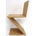 A 20TH CENTURY LIGHT ASH AFTER GERRIT RIETTVELD ZIG ZAG CHAIR  with stylistic triangular jointed