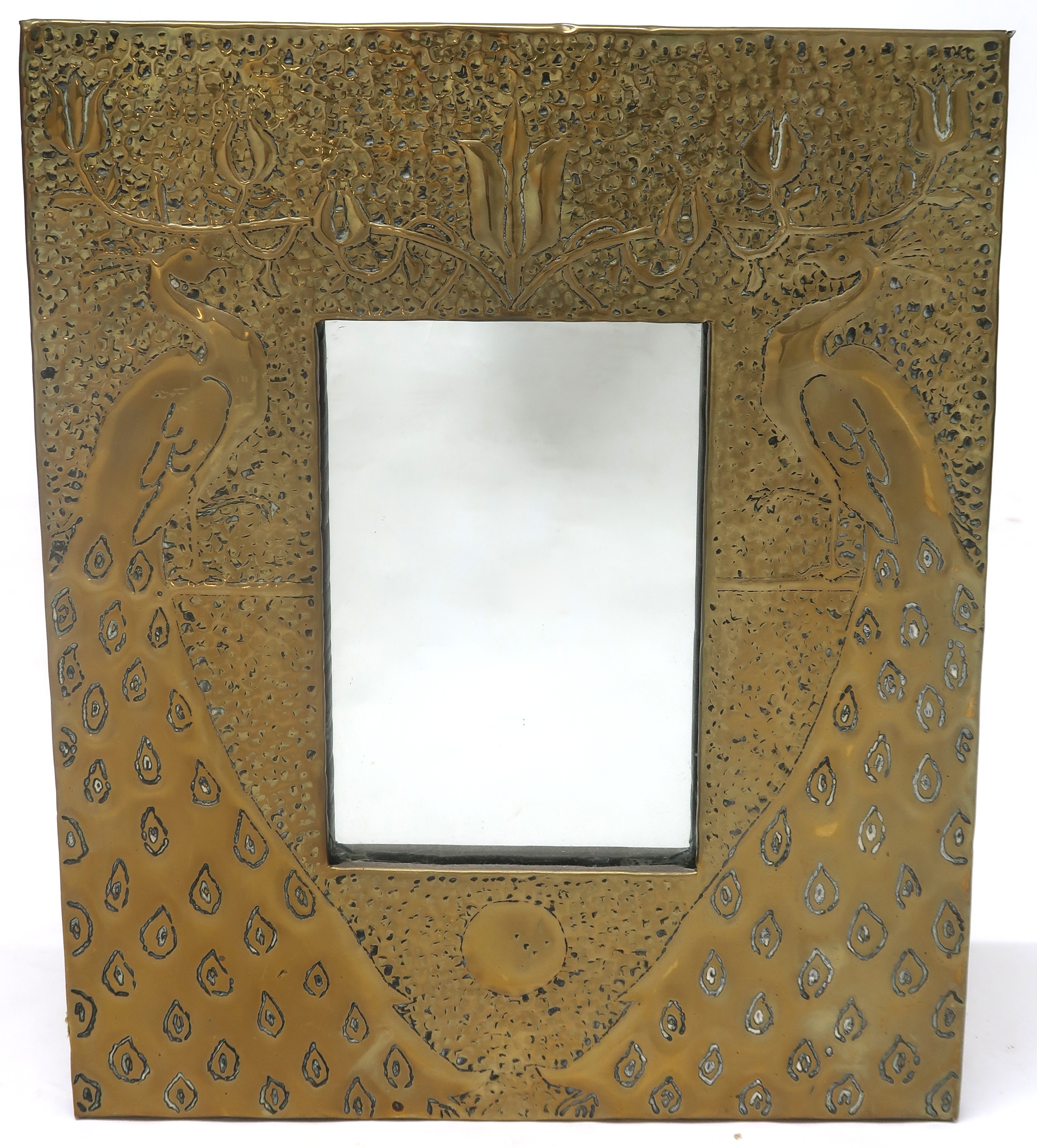 AN EARLY 20TH ARTS & CRAFTS AFTER TALWIN MORRIS WALL MIRROR with hammered brass frame depicting