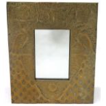 AN EARLY 20TH ARTS & CRAFTS AFTER TALWIN MORRIS WALL MIRROR with hammered brass frame depicting