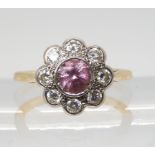 A PINK SAPPHIRE & DIAMOND FLOWER CLUSTER set throughout in bright yellow and white metal, the