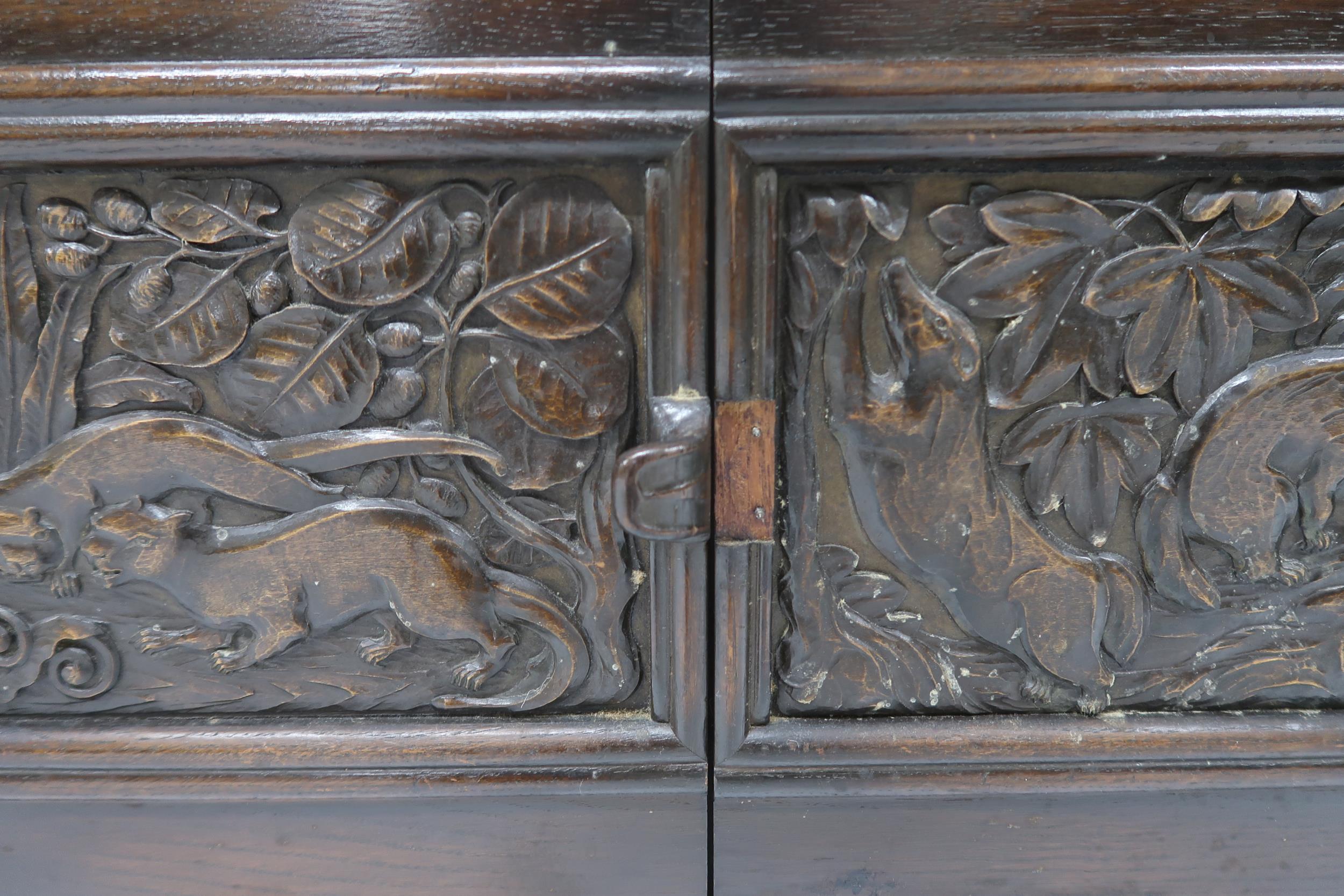 AN ARTS AND CRAFTS OAK AND BURR WALNUT COFFER the three section hinged top carved with foxes and - Image 11 of 16