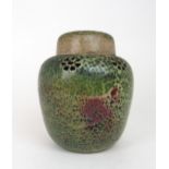 A RUSKIN POTTERY POT POURRI GINGER JAR AND COVER of typical form with mottled green and sang de