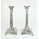 A PAIR OF GEORGE V SILVER CANDLESTICKS by Fattorini & Sons, Birmingham 1923, modelled as