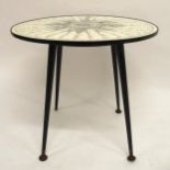 A MID 20TH CENTURY AFTER FORNASETTI CIRCULAR OCCASIONAL TABLE with revolving Formica top decorated