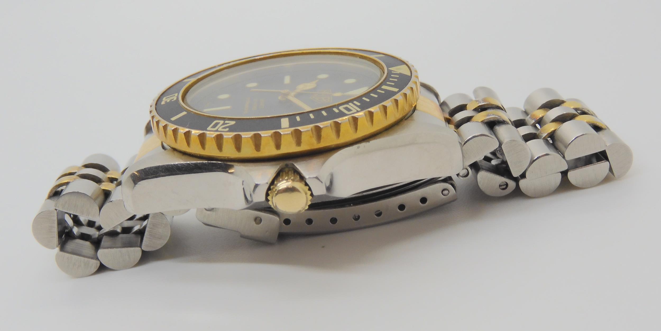 A VINTAGE HEUER WRISTWATCH circa 1983, steel and gold plate diver's watch.  The watch has a black - Image 5 of 11