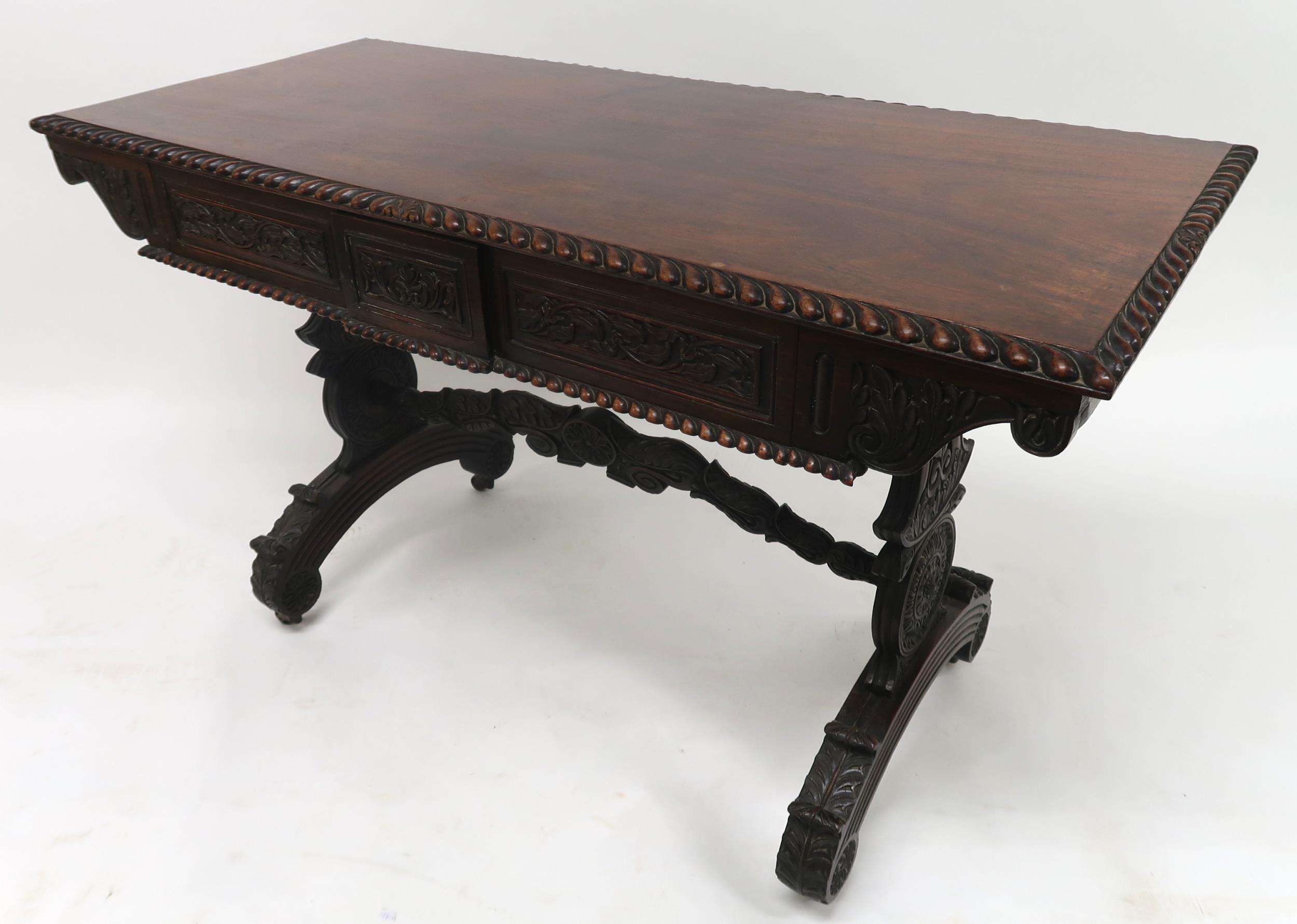 AN ANGLO-INDIAN ROSEWOOD LIBRARY TABLE with rectangular gadrooned top over a pair of asymmetrical - Image 11 of 13