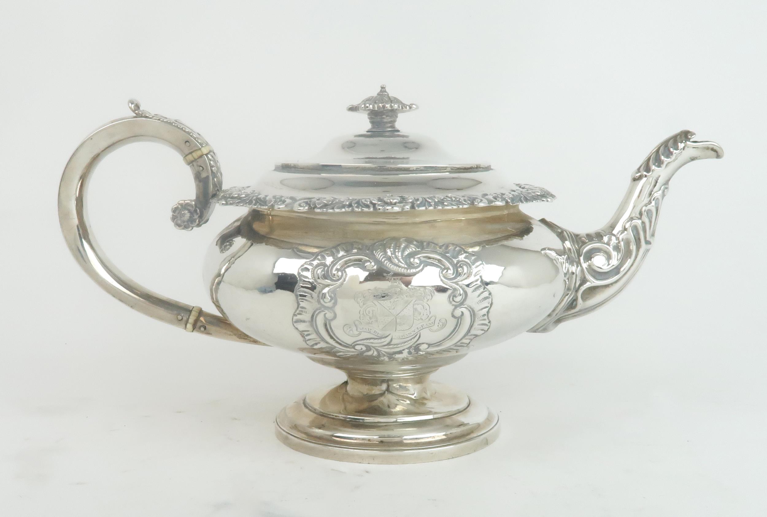 A GEORGE IV SCOTTISH SILVER TEAPOT by J Hay, Edinburgh 1820, of squat circular form, with an