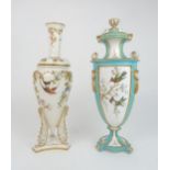 A CROWN DERBY PORCELAIN URN AND COVER the white ground with three panels painted with hummingbirds