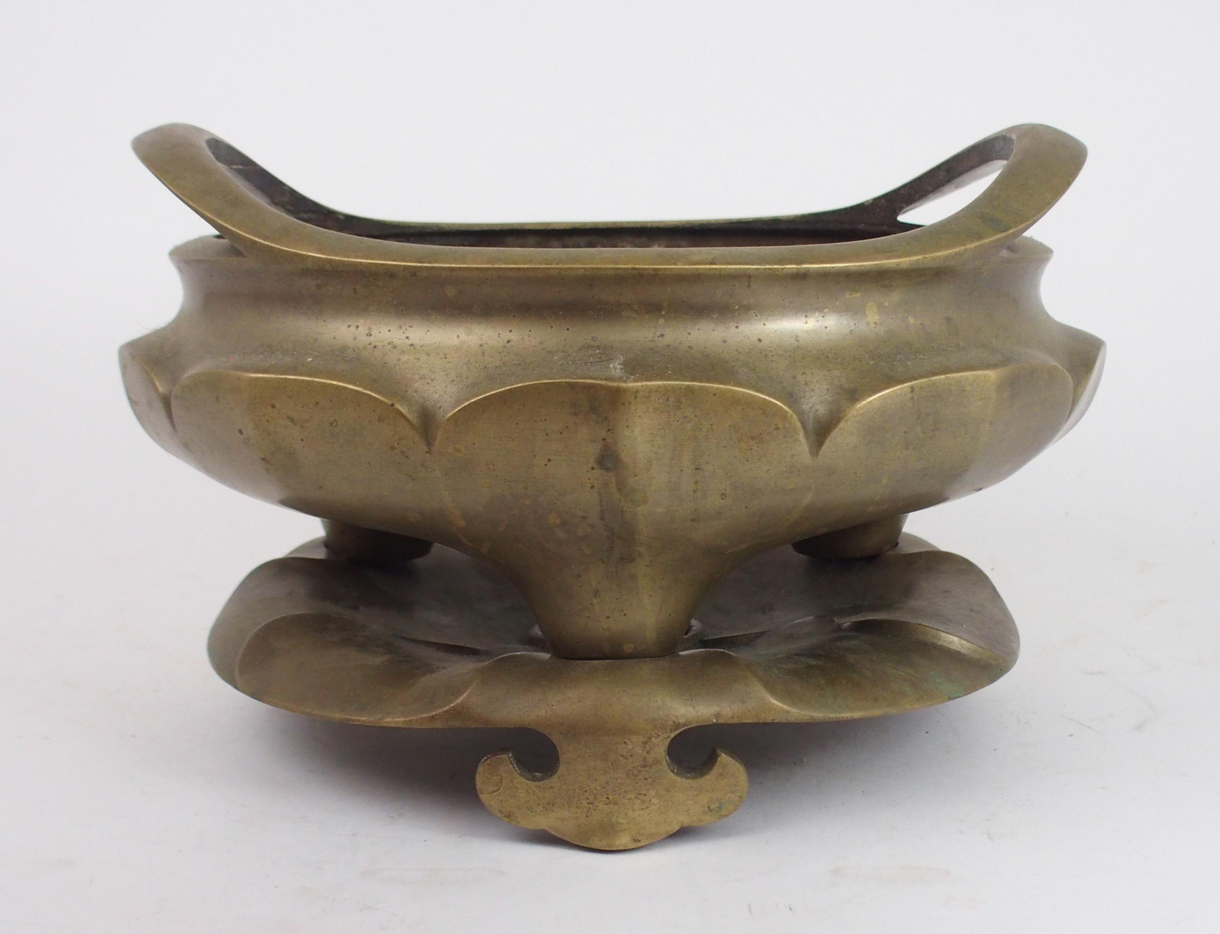 A LARGE CHINESE BRASS CENSER  the raised twin handles above lotus lobed sides and on tripod feet and - Image 3 of 7