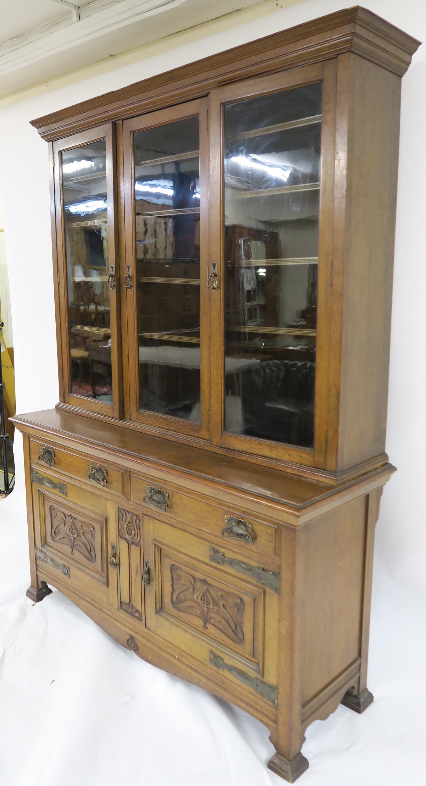 A LATE VICTORIAN OAK ARTS & CRAFTS BOOKCASE with moulded cornice over three glazed doors over two - Image 9 of 9