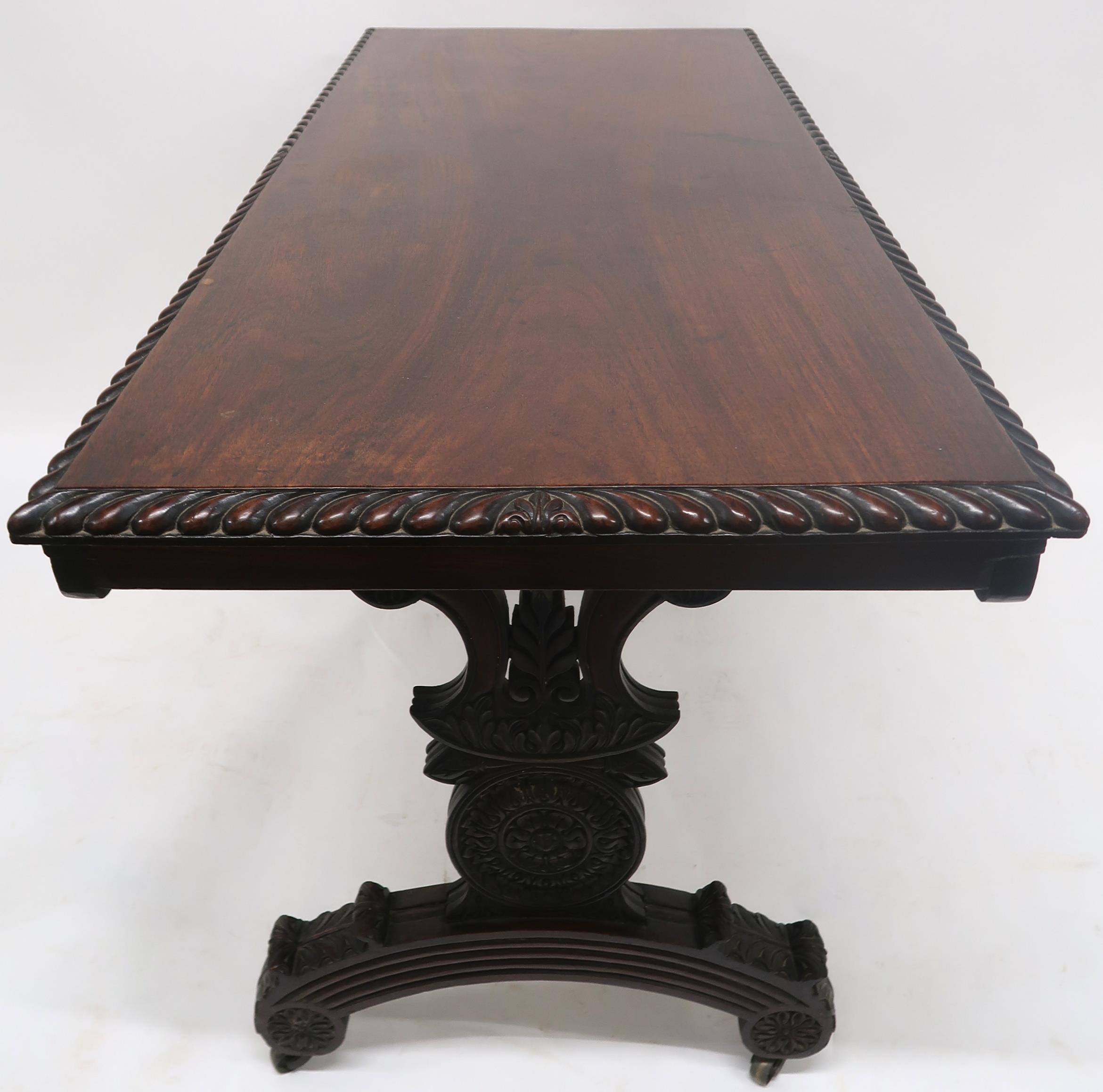 AN ANGLO-INDIAN ROSEWOOD LIBRARY TABLE with rectangular gadrooned top over a pair of asymmetrical - Image 12 of 13