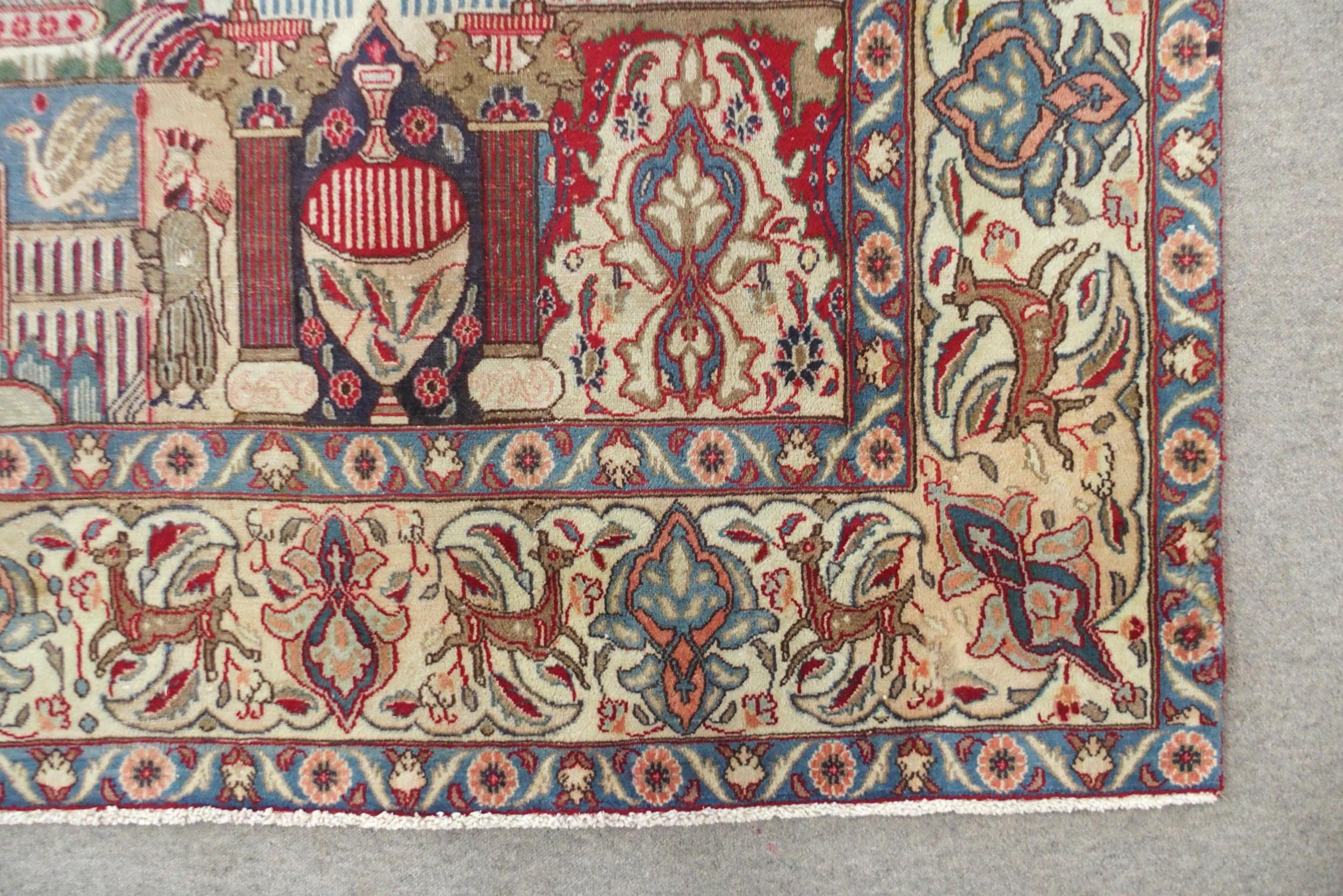 A MULTICOLOURED GROUND KASHMAR RUG with red and blue central medallion upon an extensively decorated - Image 6 of 10