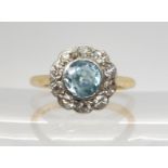 A BLUE ZIRCON AND DIAMOND RING set in 18ct yellow gold and platinum. The zircon is approx 5.5mm in