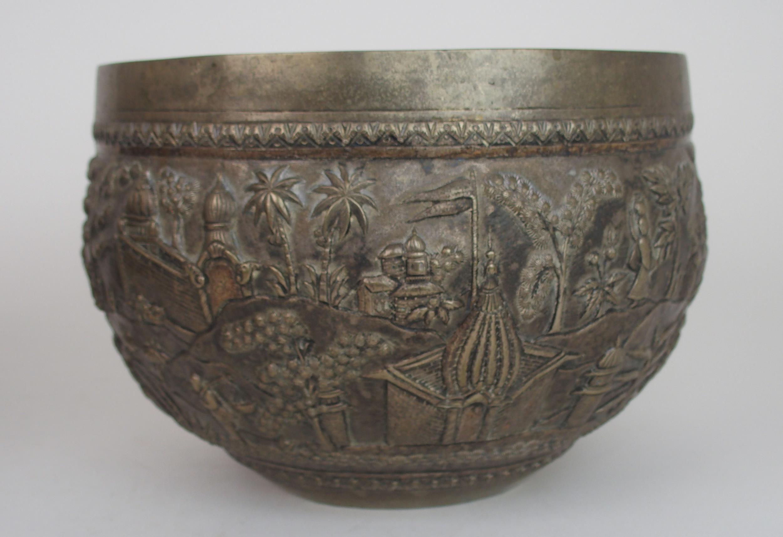 A BURMESE SILVER BOWL of rounded form, with profusely embossed and repousse work of villagers, - Image 10 of 13