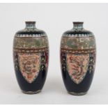 A PAIR OF JAPANESE CLOISONNE BALUSTER VASES BY OTA JIN'NOE (1858-1907) decorated with stiff leaf