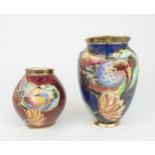 TWO CARLTON WARE CRESTED BIRD AND WATERLILY PATTERN VASES one on a blue ground, pattern no. 3529,