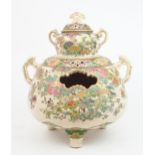 A SATSUMA THREE SECTION PIERCED TWO HANDLED POT POURRIE VASE  painted with multiple flowers and