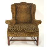 AN 18TH CENTURY STYLE WINGBACK ARMCHAIR with mustard foliate damask upholstered seat on