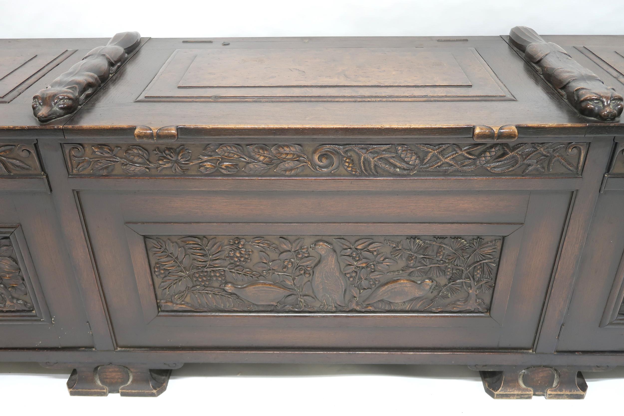 AN ARTS AND CRAFTS OAK AND BURR WALNUT COFFER the three section hinged top carved with foxes and - Image 13 of 16